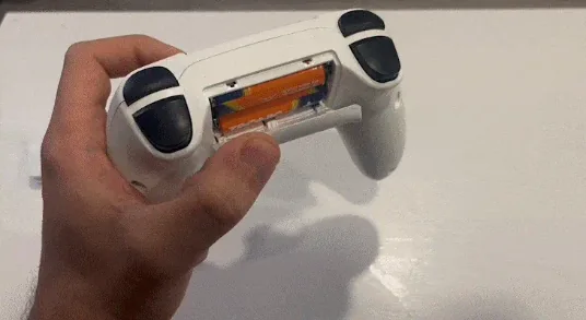 Wireless controller opened to insert AA batteries